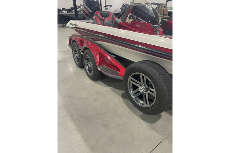 Slide: The Image of 2018 Ranger Z521L boat with red and white design on a triple-axle trailer. - 4