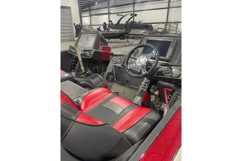 Slide: The Image of 2018 Ranger Z521L boat interior with red and black seats, steering wheel, and dashboard. - 5