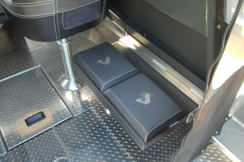 Slide: The Image of 2025 Stabicraft 2250 Ultra Centrecab interior with cushioned seating and diamond plate flooring. - 14