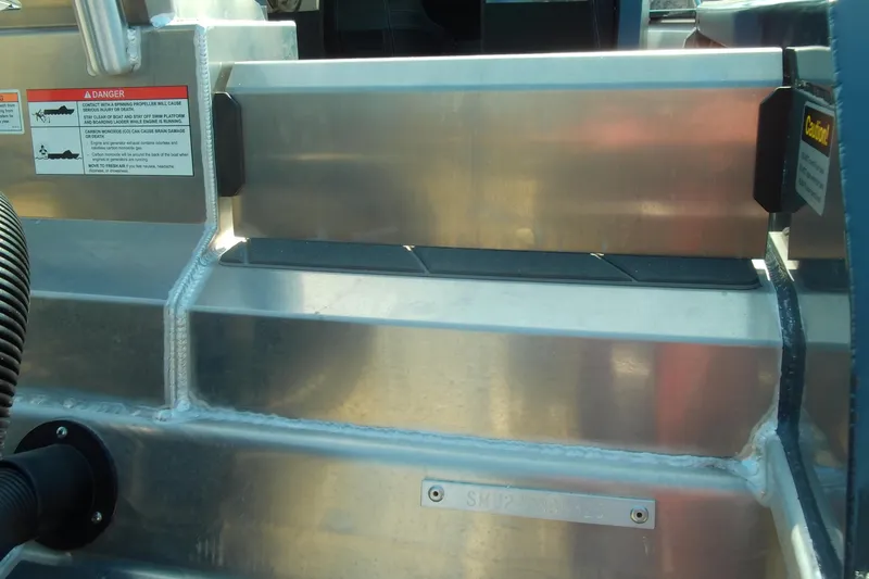 Slide: The Image of 2025 Stabicraft 2250 Ultra Centrecab boat detail, featuring metal construction and safety warnings. - 28