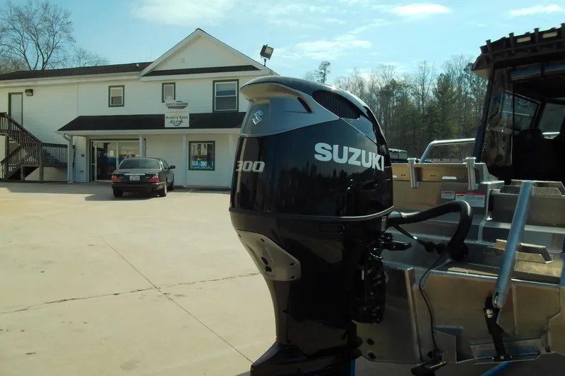 Slide: The Image of Stabicraft 2250 Ultra Centrecab 2025 with Suzuki 300 outboard motor in marina setting. - 3