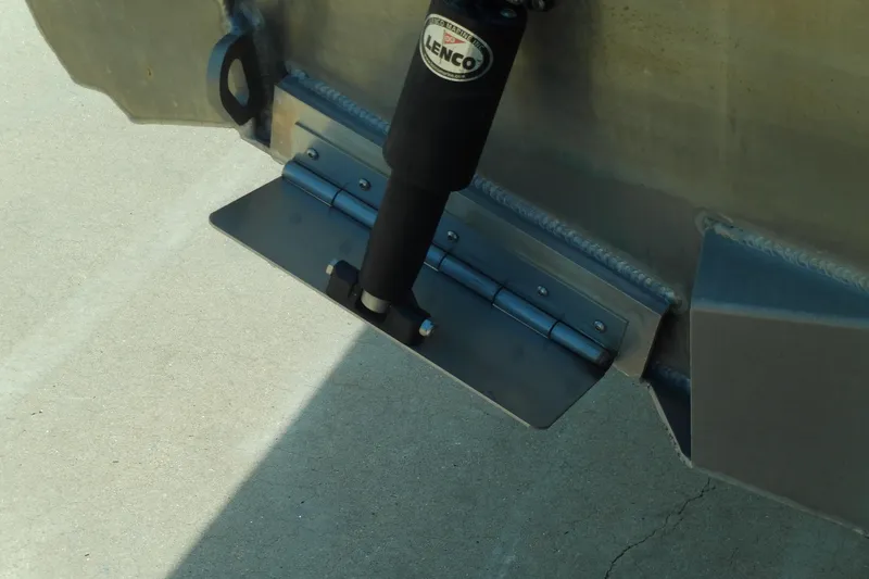 Slide: The Image of Trim tab of 2025 Stabicraft 2250 Ultra Centrecab boat, featuring Lenco actuator. - 7