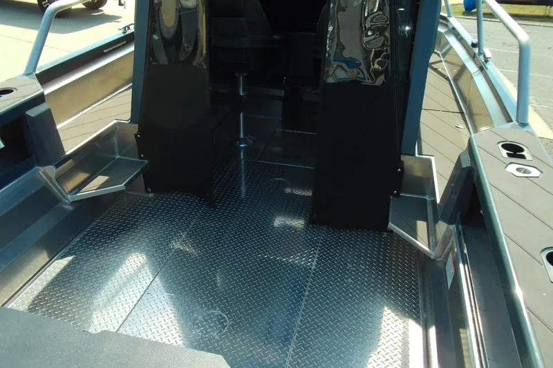 Slide: The Image of 2025 Stabicraft 2250 Ultra Centrecab interior with diamond plate flooring and sleek design. - 8