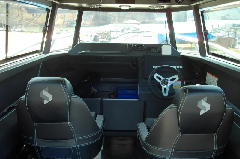 Slide: The Image of Interior of 2025 Stabicraft 2250 Ultra Centrecab with dual seats and steering console. - 9
