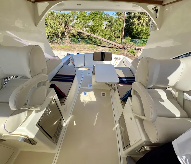 Slide: The Image of Interior of 2016 Marlow Pilot 31 boat with luxurious seating and table. - 20
