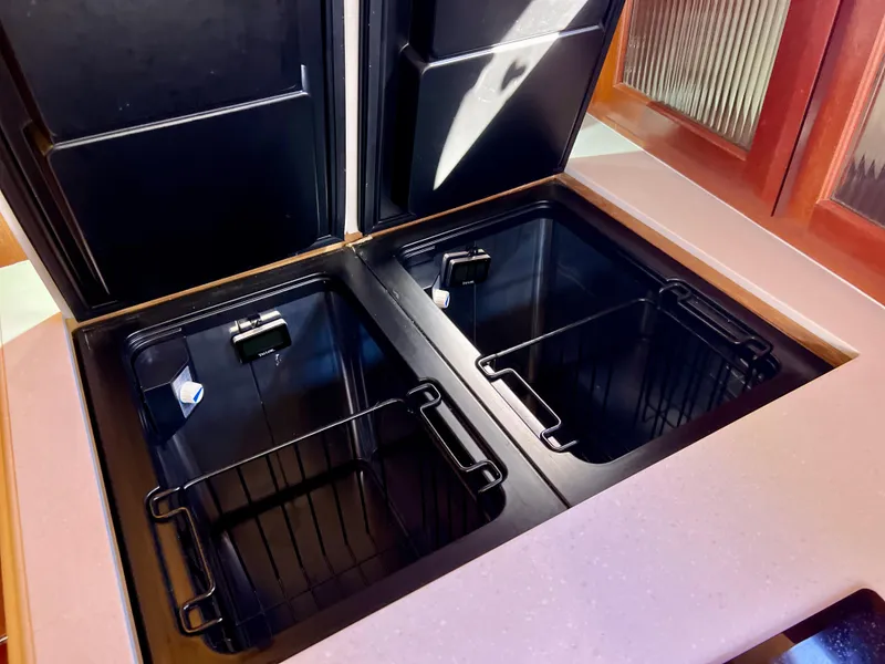 Slide: The Image of Dual compartment storage in 2016 Marlow Pilot 31 Pilot boat interior. - 28