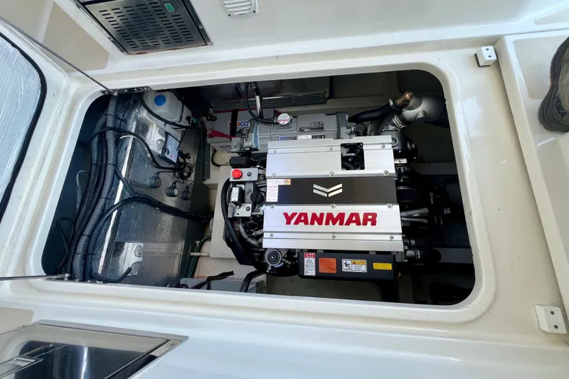 Slide: The Image of Engine compartment of 2016 Marlow Pilot 31 with Yanmar engine visible. - 46