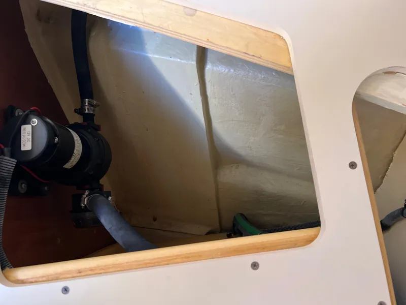 Slide: The Image of Interior view of 2016 Marlow Pilot 31 boat showing pump and tubing. - 51