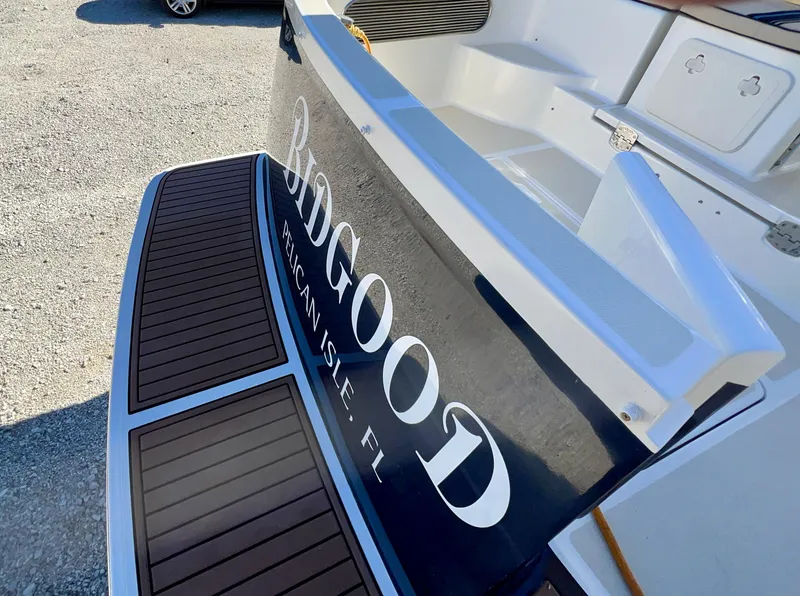 Slide: The Image of Marlow Pilot 31 boat stern with "Bidgood" text, 2016 model. - 9