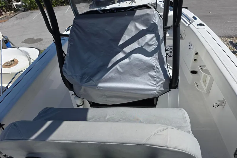 Slide: The Image of 2022 Wellcraft 222 Fisherman boat interior with covered seating and console. - 5