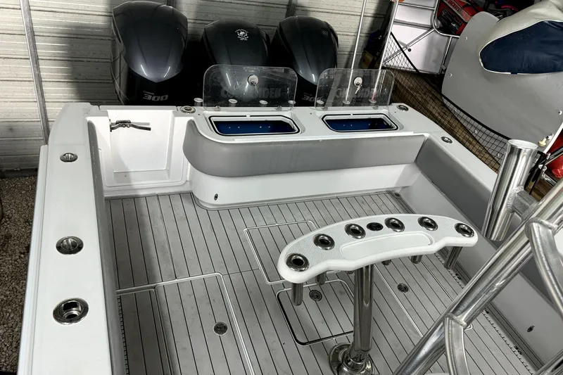 Slide: The Image of 2014 Contender 39 ST boat deck with rod holders and dual livewells. - 19