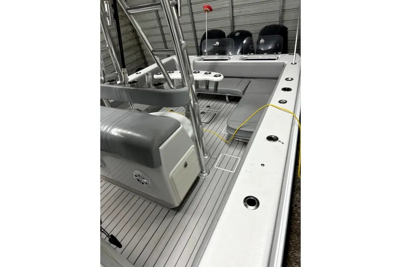 Slide: The Image of 2014 Contender 39 ST boat interior with seating and fishing rod holders. - 23