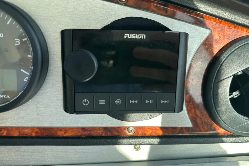 Slide: The Image of Dashboard of 2011 Cruisers Yachts 540 Sports Coupe with Fusion audio system. - 11