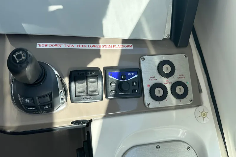 Slide: The Image of Control panel of 2011 Cruisers Yachts 540 Sports Coupe with joystick and ignition switches. - 14