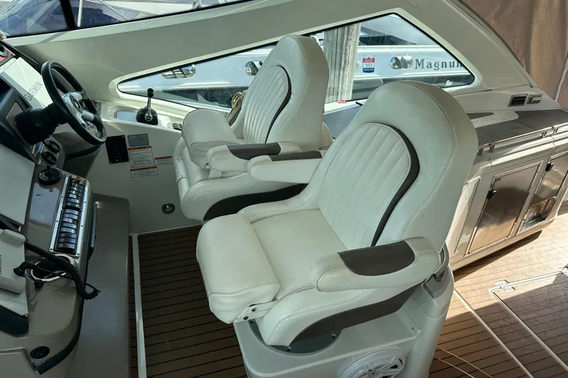 Slide: The Image of Interior of 2011 Cruisers Yachts 540 Sports Coupe with luxury seating and control panel. - 15
