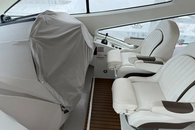 Slide: The Image of Interior of 2011 Cruisers Yachts 540 Sports Coupe with white leather seats. - 17