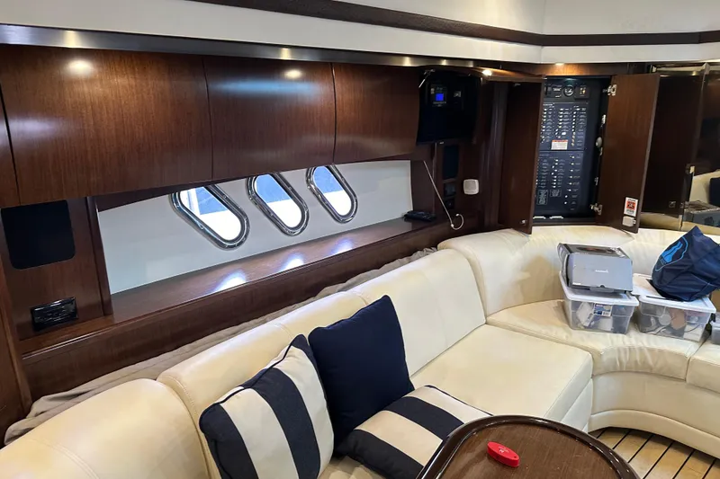 Slide: The Image of Luxurious interior of 2011 Cruisers Yachts 540 Sports Coupe with plush seating and wood accents. - 25