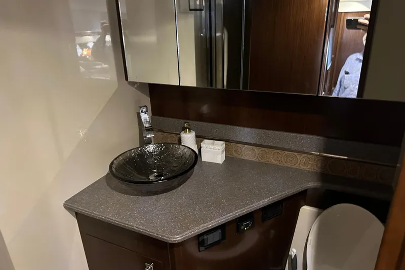 Slide: The Image of Luxurious bathroom in 2011 Cruisers Yachts 540 Sports Coupe with modern glass sink. - 30