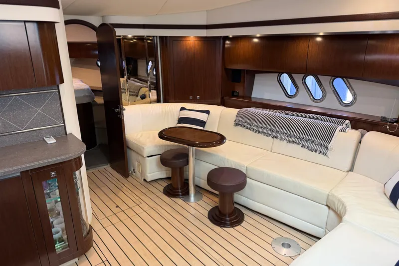 Slide: The Image of Luxurious interior of 2011 Cruisers Yachts 540 Sports Coupe with elegant seating and wood finishes. - 47