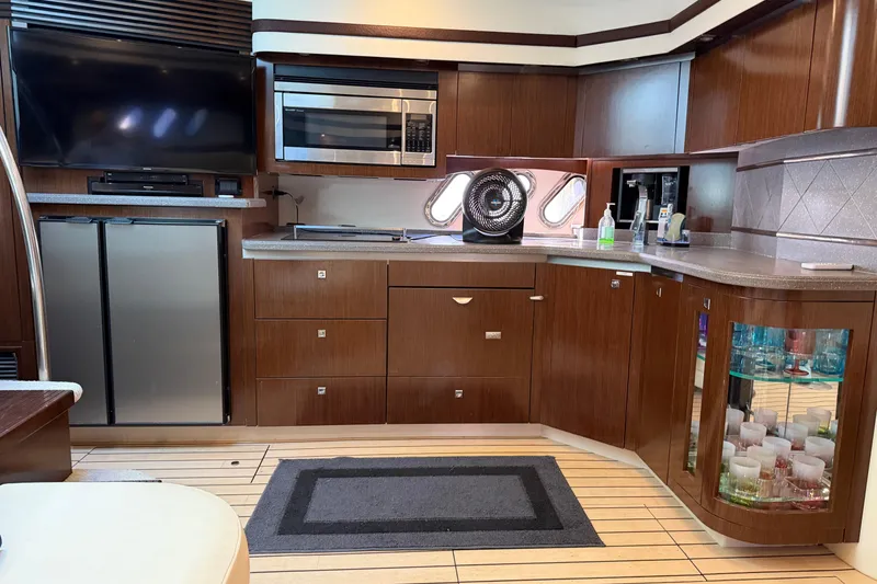 Slide: The Image of Luxurious 2011 Cruisers Yachts 540 Sports Coupe interior with modern kitchen and entertainment area. - 48