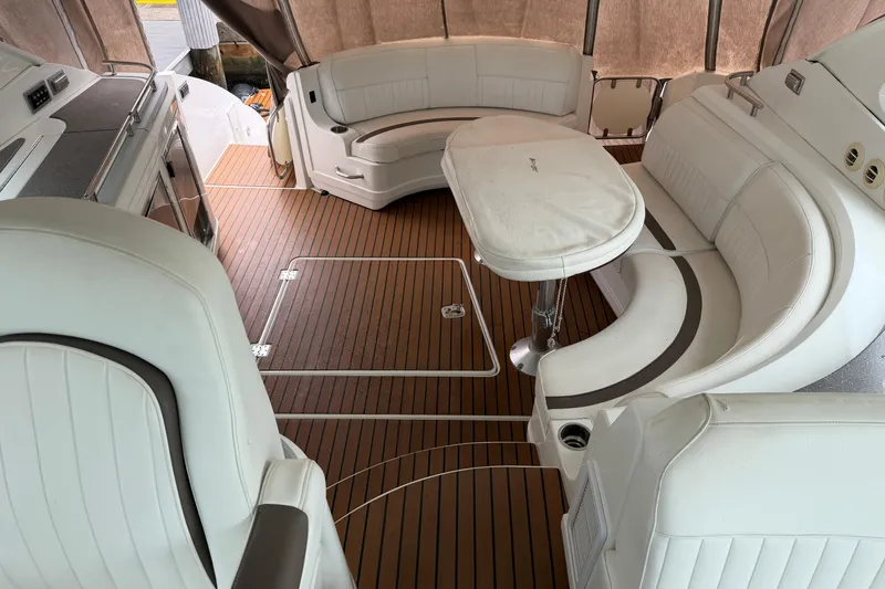 Slide: The Image of Luxurious interior of 2011 Cruisers Yachts 540 Sports Coupe with elegant seating and table. - 6