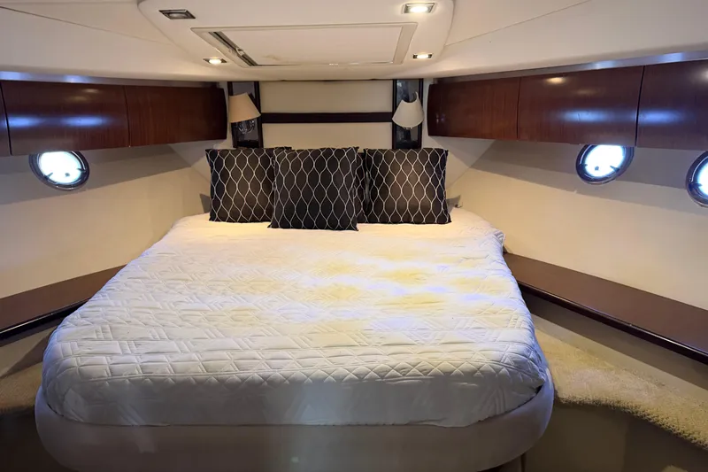 Slide: The Image of Luxurious cabin interior of 2011 Cruisers Yachts 540 Sports Coupe with cozy bed and elegant decor. - 67