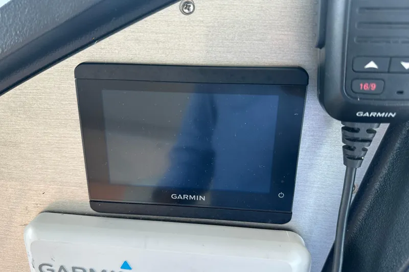 Slide: The Image of Garmin display and radio on 2011 Cruisers Yachts 540 Sports Coupe dashboard. - 12