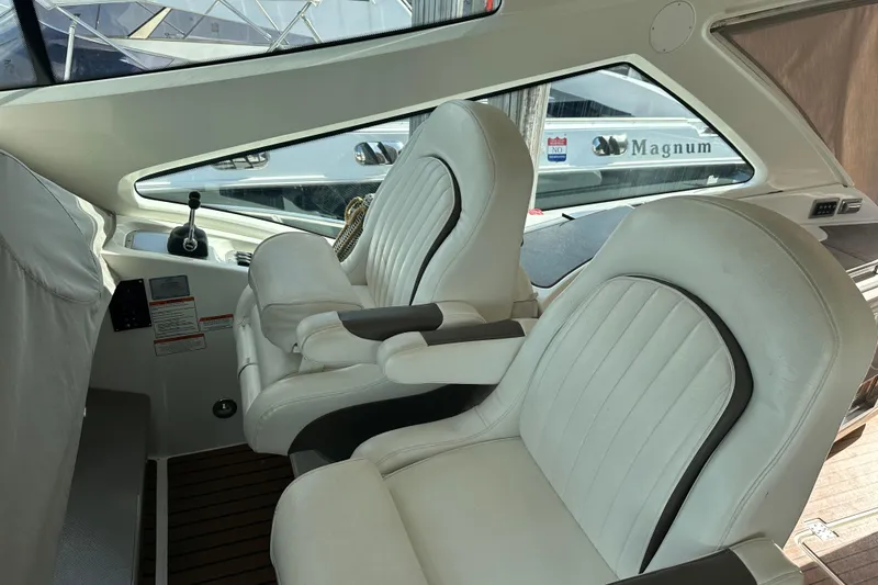 Slide: The Image of Interior of 2011 Cruisers Yachts 540 Sports Coupe with white leather seats. - 16