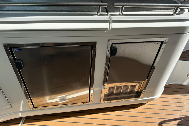 Slide: The Image of 2011 Cruisers Yachts 540 Sports Coupe, stainless steel storage compartments on deck. - 21