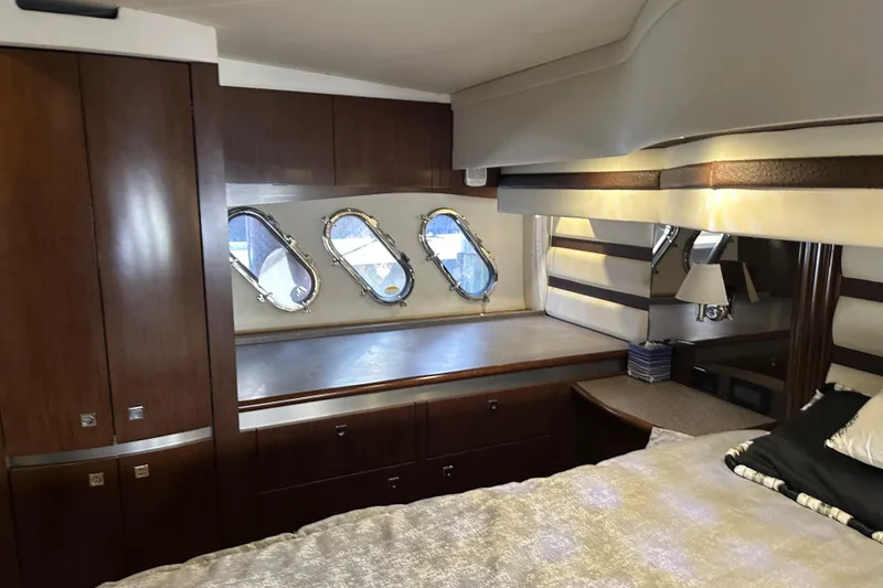 Slide: The Image of Luxurious 2011 Cruisers Yachts 540 Sports Coupe cabin interior with elegant wood finishes. - 22