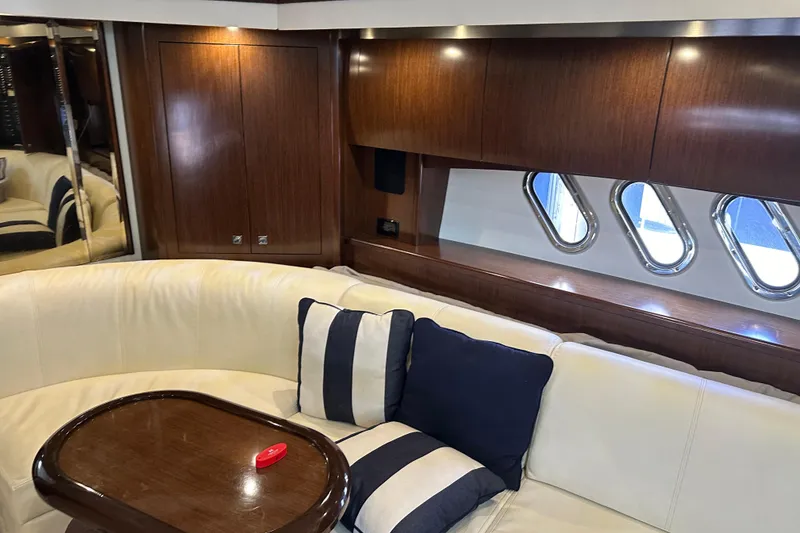 Slide: The Image of Luxurious interior of 2011 Cruisers Yachts 540 Sports Coupe with elegant seating and wood finish. - 26