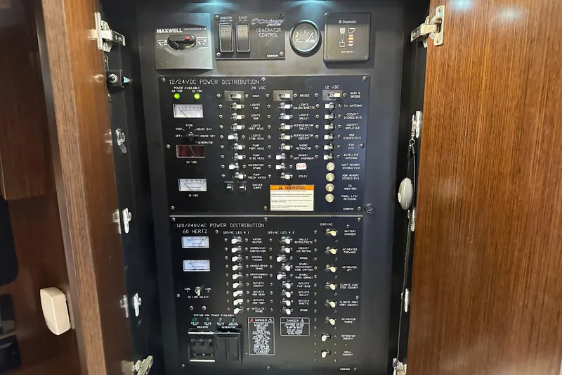 Slide: The Image of Electrical panel of 2011 Cruisers Yachts 540 Sports Coupe, showcasing power distribution controls. - 39