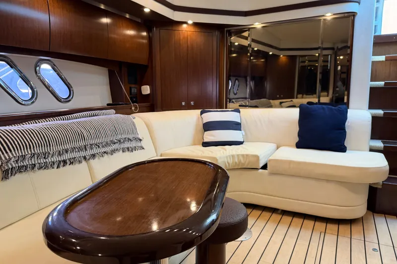 Slide: The Image of Luxurious interior of 2011 Cruisers Yachts 540 Sports Coupe with elegant seating and wooden accents. - 45