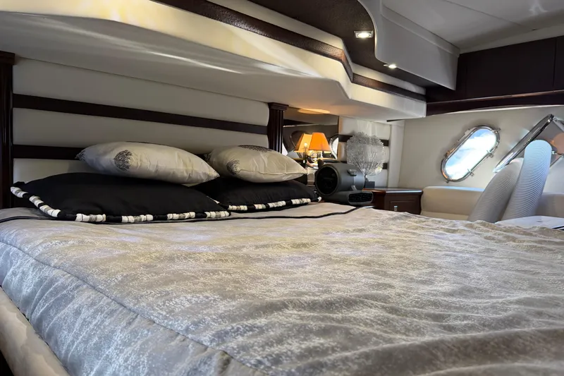 Slide: The Image of Luxurious bedroom interior of 2011 Cruisers Yachts 540 Sports Coupe with elegant bedding. - 52