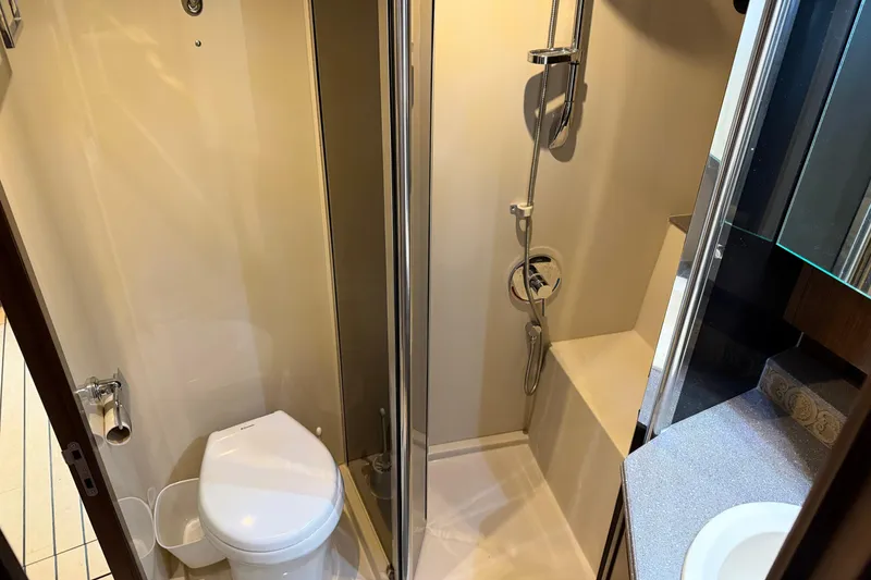 Slide: The Image of 2011 Cruisers Yachts 540 Sports Coupe bathroom with shower and toilet. - 66