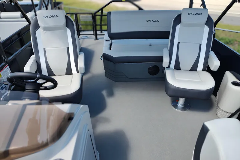 Slide: The Image of Interior of 2026 Sylvan MIRAGE X1 CLZ DH boat with modern seating and steering wheel. - 15