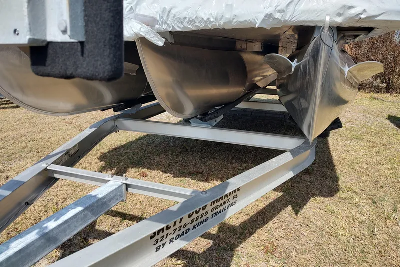 Slide: The Image of 2026 Sylvan MIRAGE X1 CLZ DH pontoon boat on trailer, side view. - 17