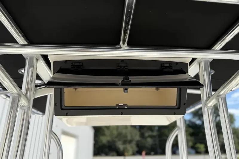 Slide: The Image of 2026 Bulls Bay 230 Center Console boat with open storage compartment under T-top. - 10