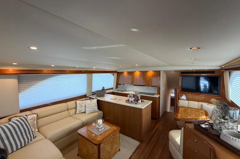 Slide: The Image of Luxurious interior of 2004 Viking 56 Convertible yacht with elegant seating and modern amenities. - 17