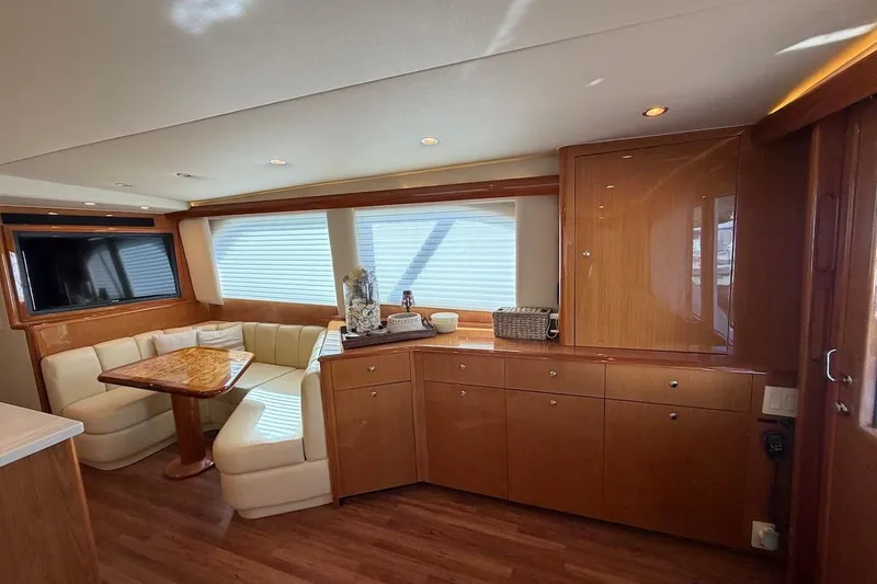 Slide: The Image of Luxurious interior of 2004 Viking 56 Convertible yacht with elegant wood finishes and seating area. - 19