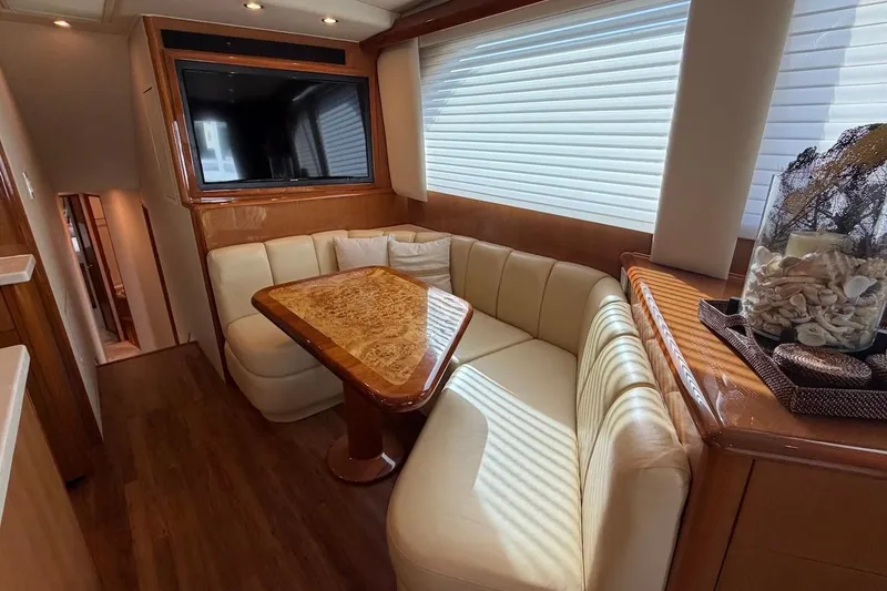 Slide: The Image of Luxurious interior of 2004 Viking 56 Convertible yacht with plush seating and elegant decor. - 20