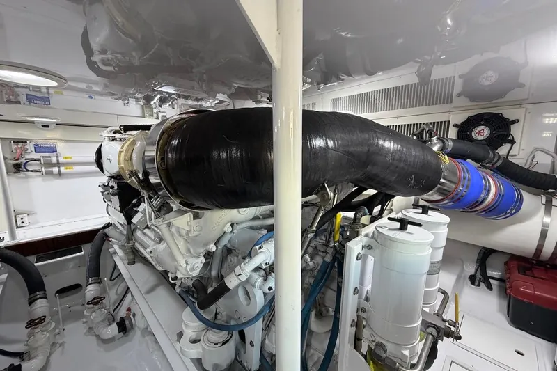 Slide: The Image of Engine room of 2004 Viking 56 Convertible yacht, showcasing detailed mechanical components. - 39