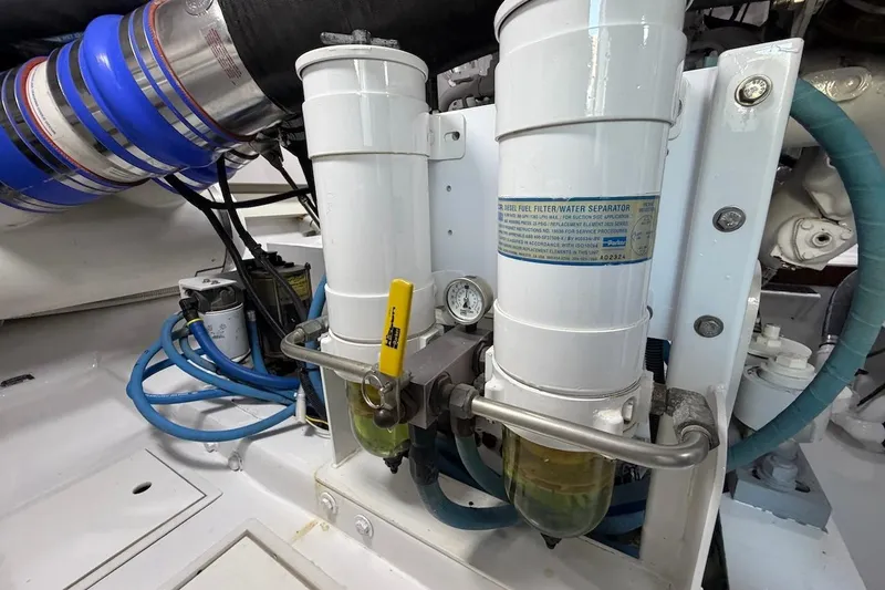 Slide: The Image of Engine room of 2004 Viking 56 Convertible with fuel filter and water separator system. - 44