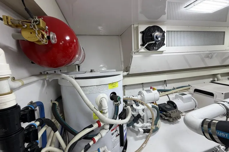 Slide: The Image of Engine room of 2004 Viking 56 Convertible yacht with fire extinguisher and ventilation system. - 45