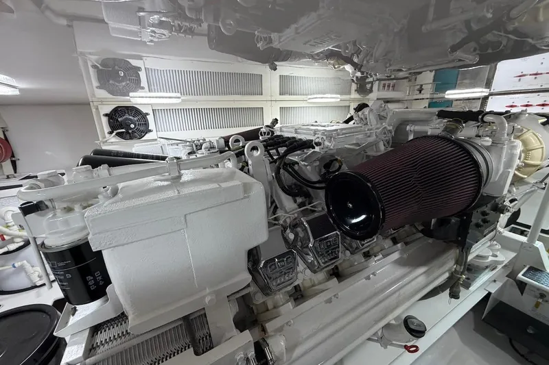 Slide: The Image of Engine room of a 2004 Viking 56 Convertible yacht, showcasing detailed machinery. - 51