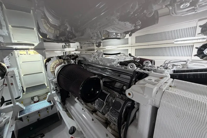 Slide: The Image of Engine room of a 2004 Viking 56 Convertible yacht, showcasing detailed machinery. - 53