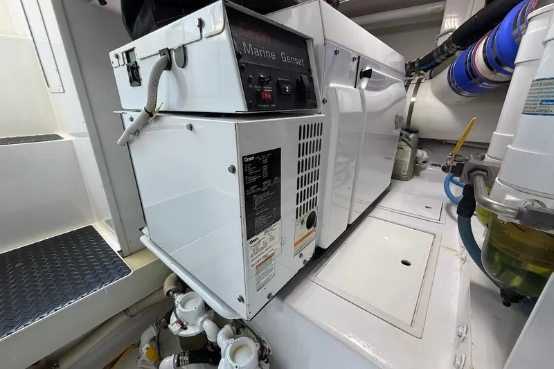 Slide: The Image of Engine room of 2004 Viking 56 Convertible yacht with marine generator and equipment. - 56