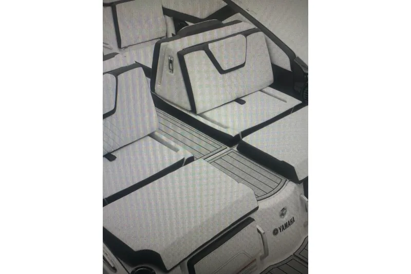 Slide: The Image of 2026 Yamaha Boats 252SD interior with sleek, modern seating and stylish design. - 10