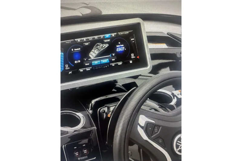 Slide: The Image of 2026 Yamaha Boats 252SD dashboard with digital display and steering wheel. - 5