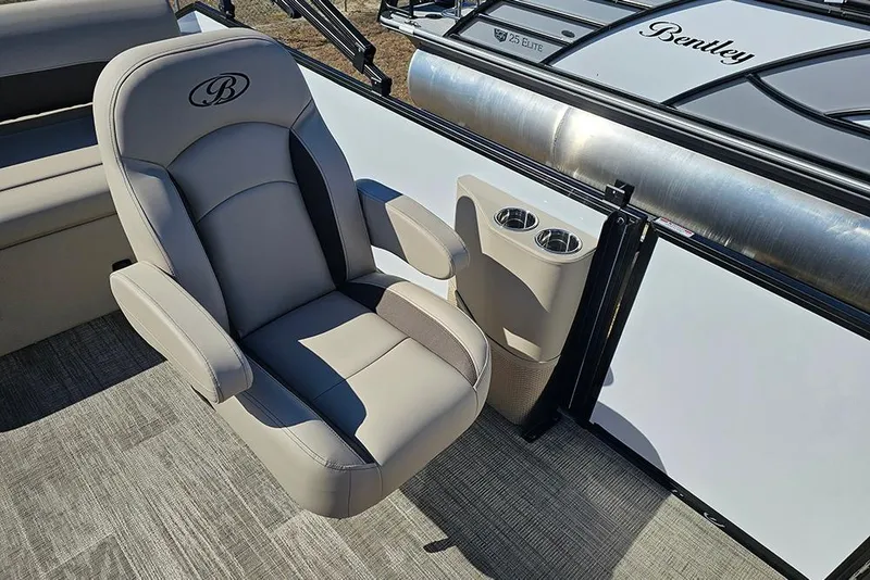 Slide: The Image of 2026 Bentley Pontoons Legacy 220 Swingback interior with luxurious seating and cup holders. - 15